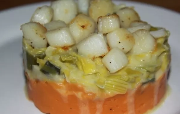 Noix de Saint-Jacques sur écrasé de patates douces et fondue de poireaux